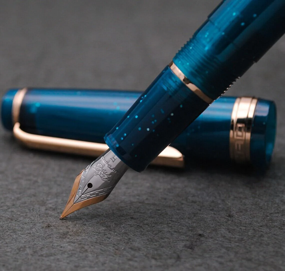 Jinhao 82 Transparent Deep Sea Blue Celluloid Fountain Pen with Fine Nib, Gold Clip & Ink Converter - Image 2