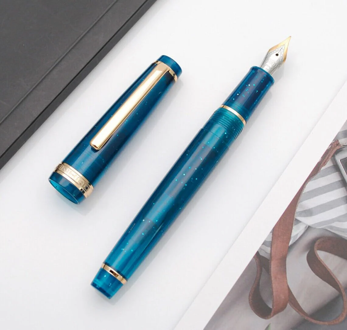 Jinhao 82 Transparent Deep Sea Blue Celluloid Fountain Pen with Fine Nib, Gold Clip & Ink Converter - Image 4