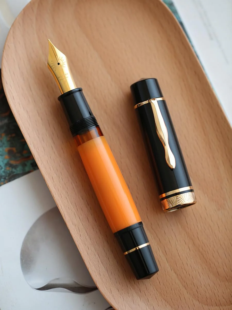 Moonman P139 Sun Carved Fountain Pen – Size 8 Nib, Brass Piston System, Large-Capacity Resin Body (Orange & Black) - Image 4