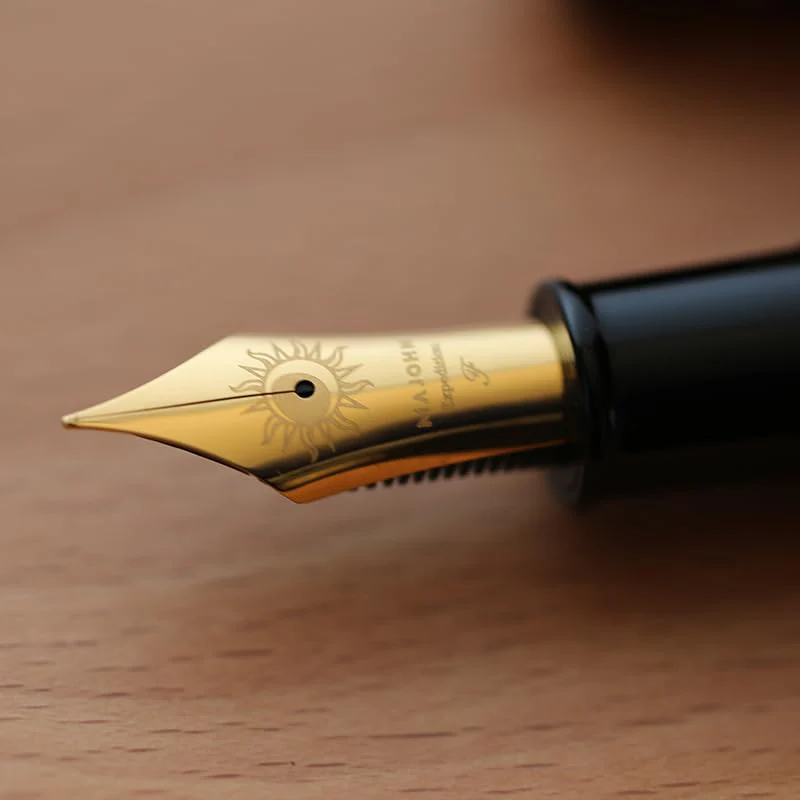 Moonman P139 Sun Carved Fountain Pen – Size 8 Nib, Brass Piston System, Large-Capacity Resin Body (Orange & Black) - Image 5